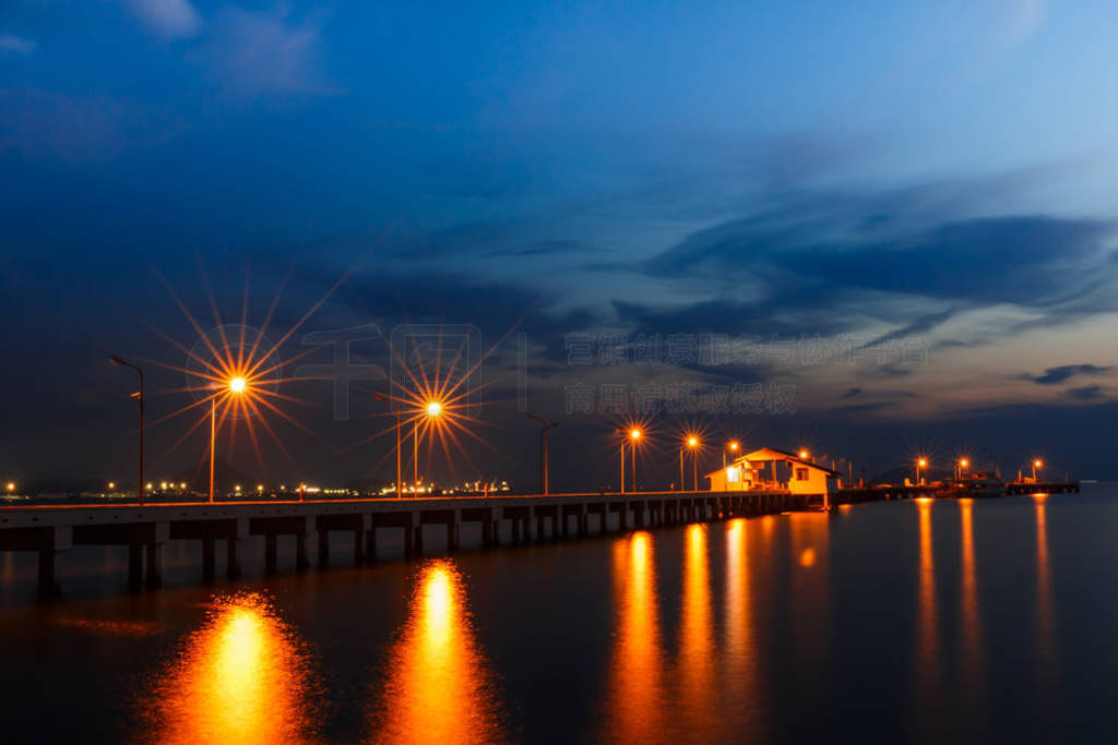 Small port ship and reflect lamp in night time