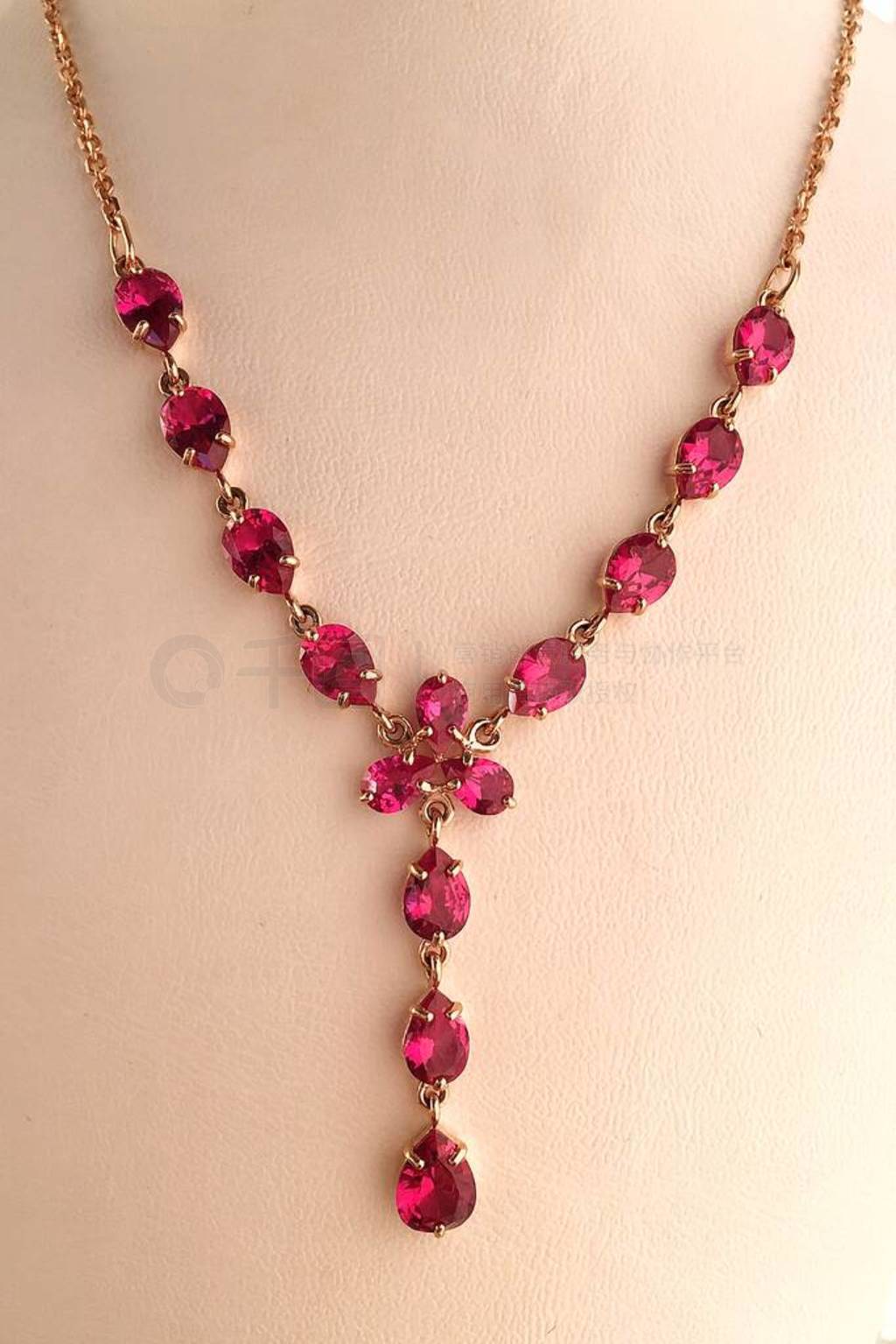 Gold ruby necklace on a jewelry stand. luxury jewelry.