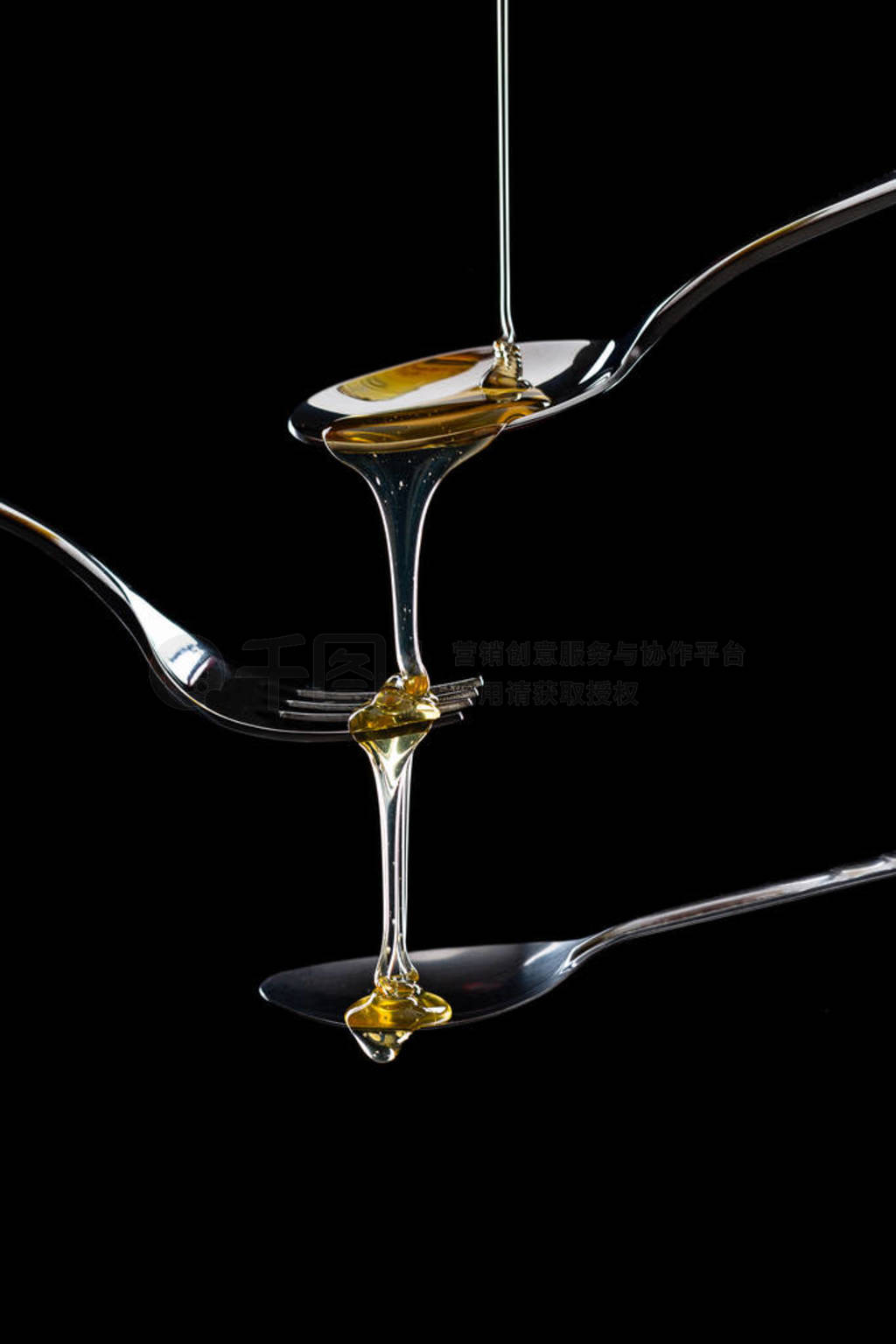 golden sweet honey dripping from spoon
