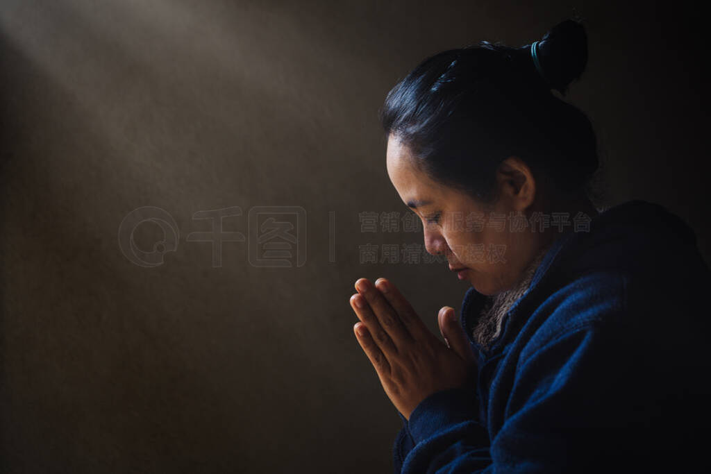 Woman Pray for god blessing to wishing have a better life.
