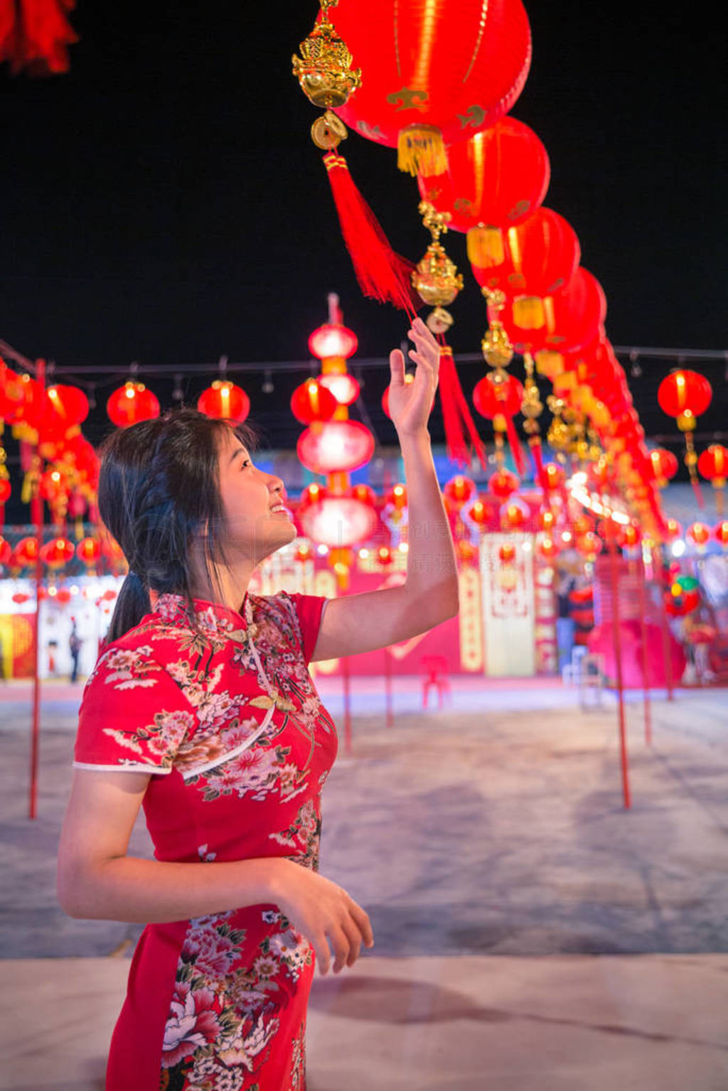 Smiling asian woman with the red lantern