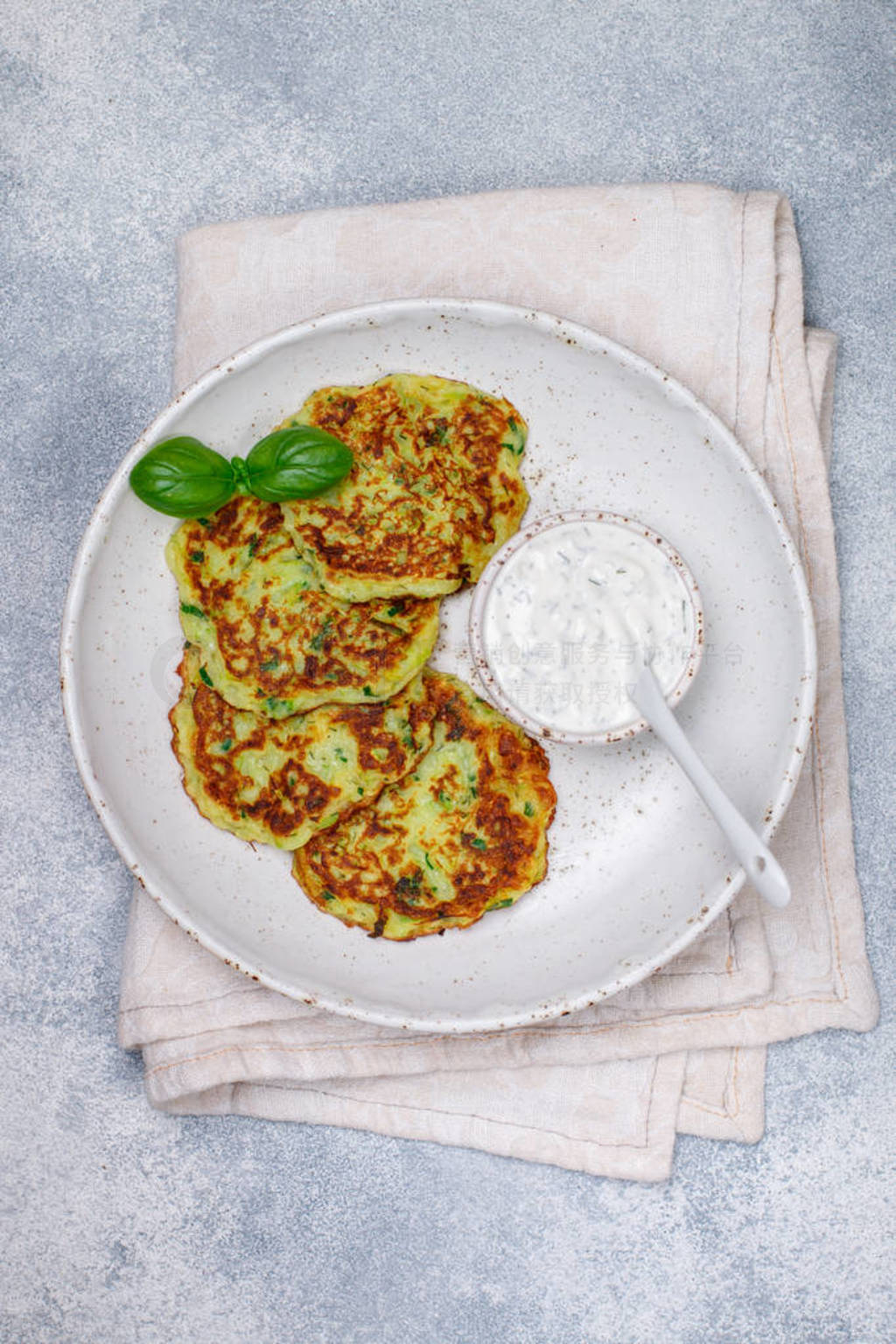 Fritters of zucchini with fresh parsley and Basil. Delicatessen