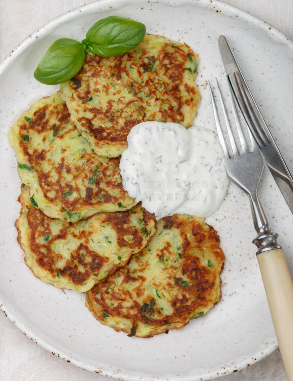 Fritters of zucchini with fresh parsley and Basil. Delicatessen