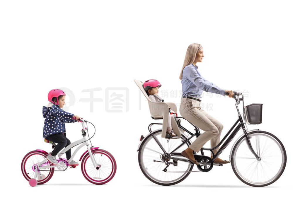 Mother riding a bicycle with a child and girl riding behind