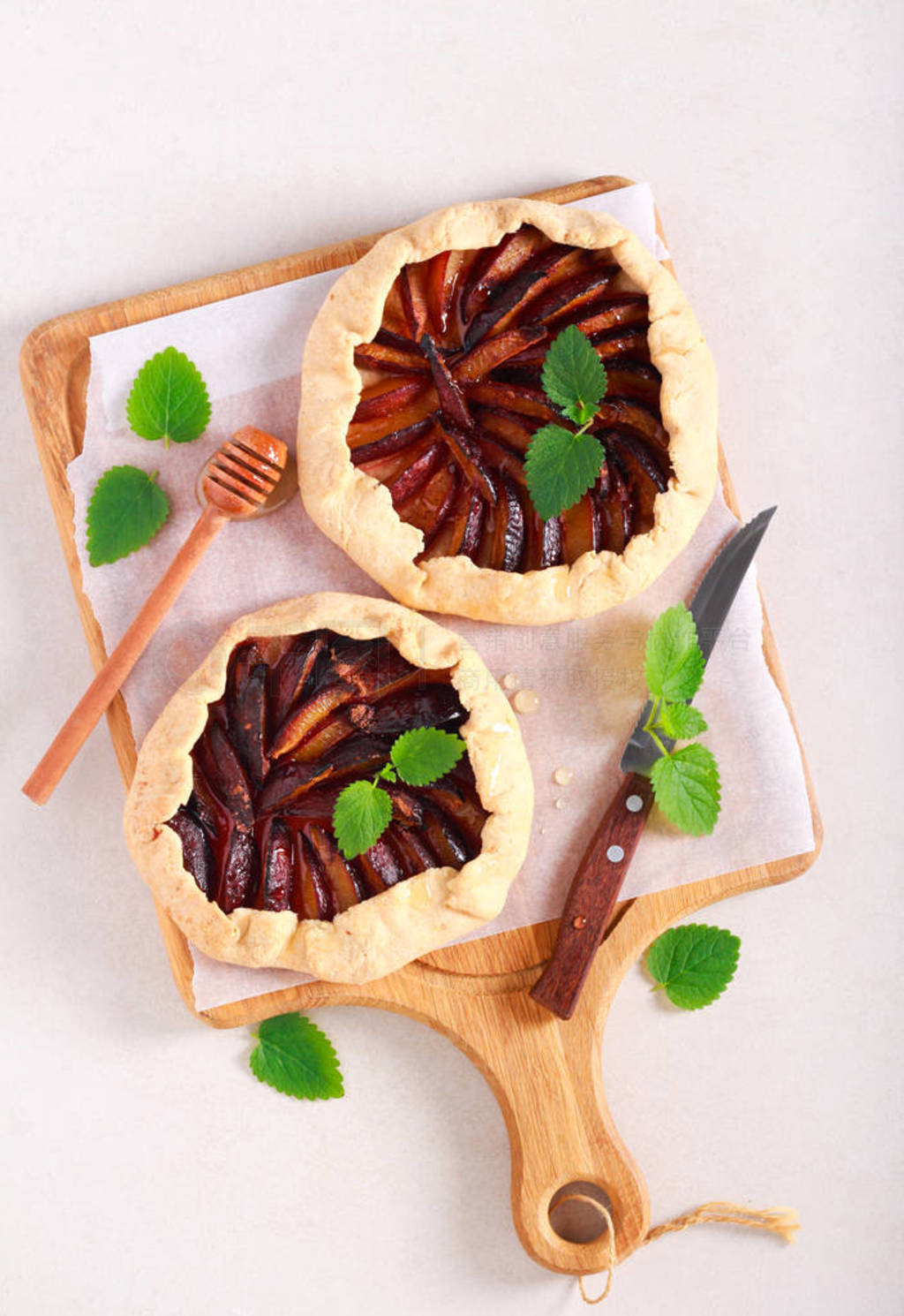 Spicy plum galettes, with honey topping