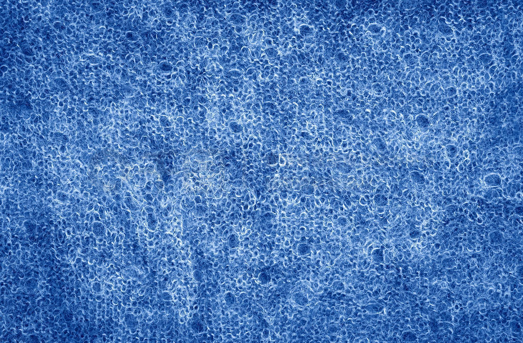 Closeup macro texture of knitted dark classic blue wool fabric s