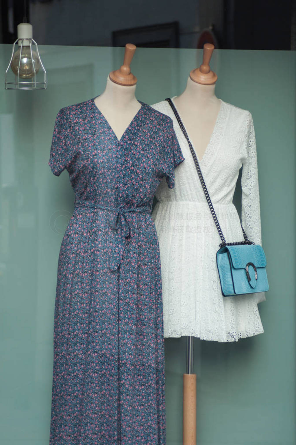 closeup of white dress on mannequin in women fashion store