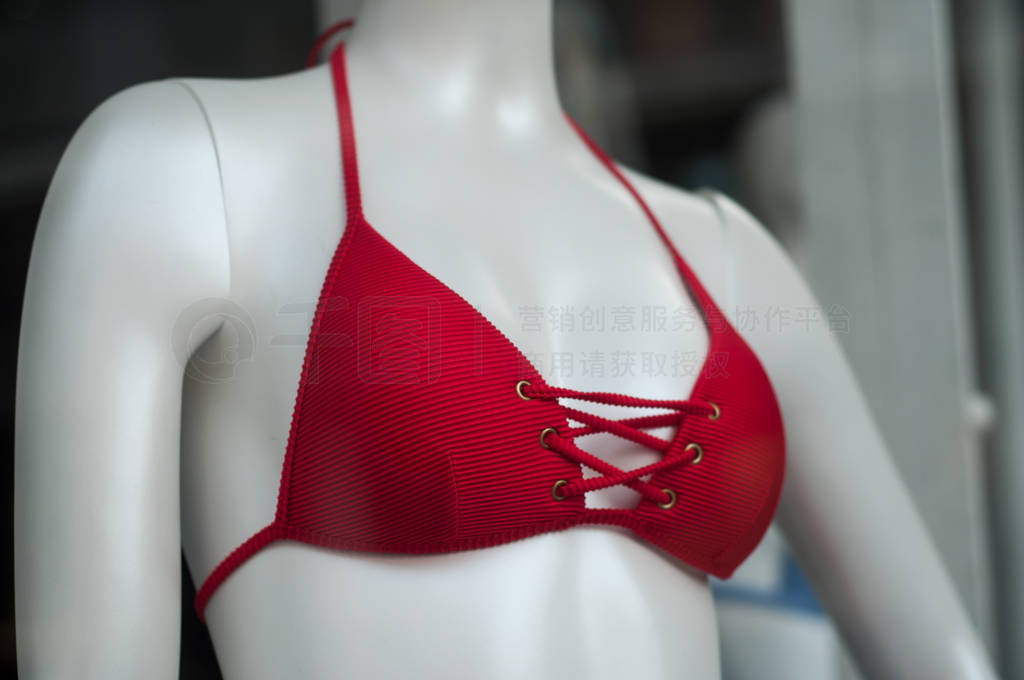 red bikini on mannequin in fashion store showroom
