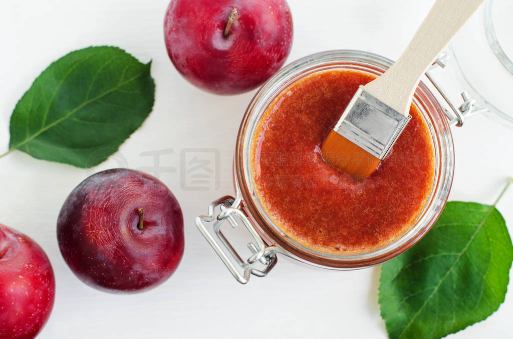 Homemade plum face mask in a glass jar. DIY cosmetics and spa re