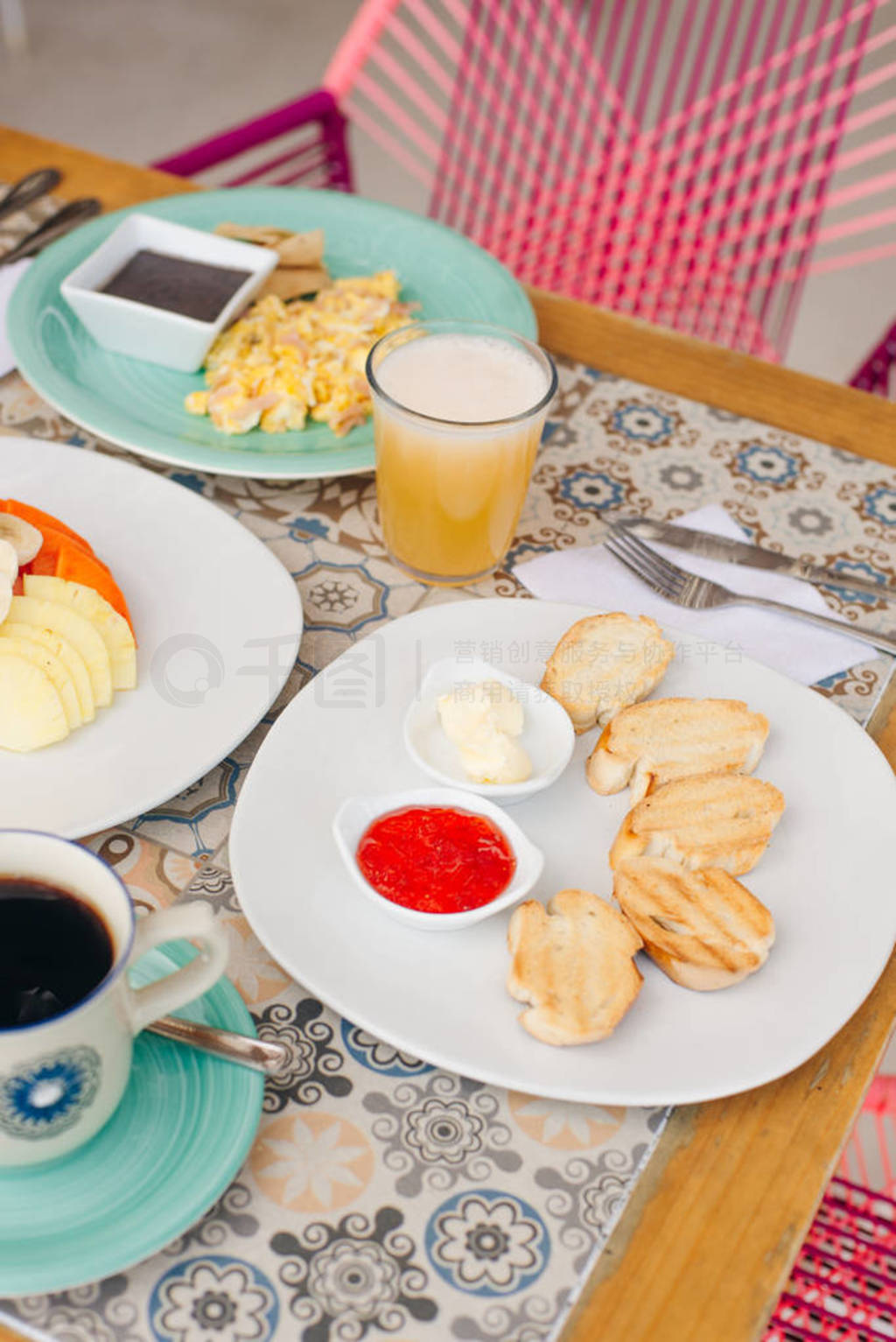 breakfast for two in the hotel with eggs, toast and fruit
