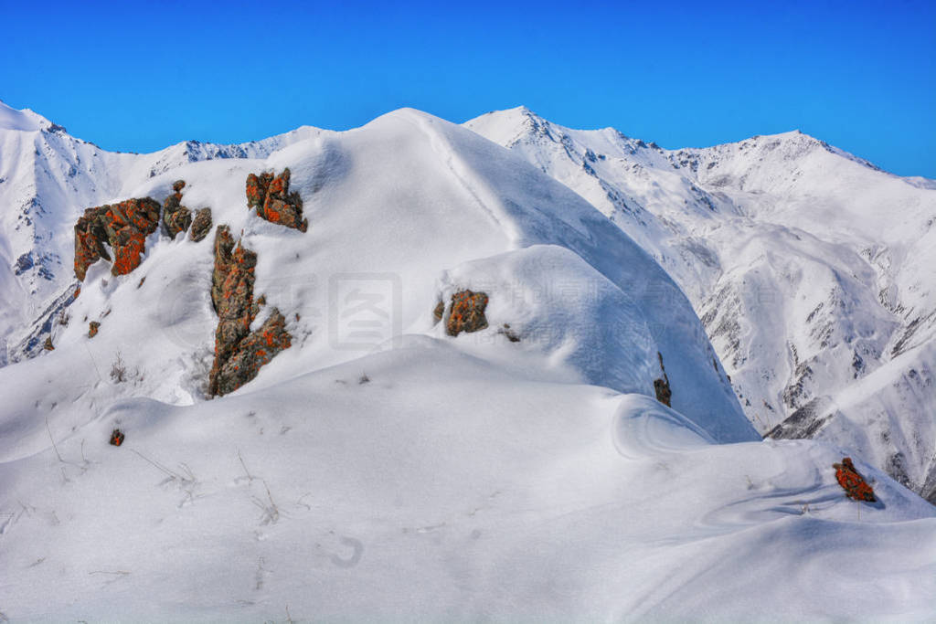 Winter snow covered mountain peaks. Tourists Ala-Archa National