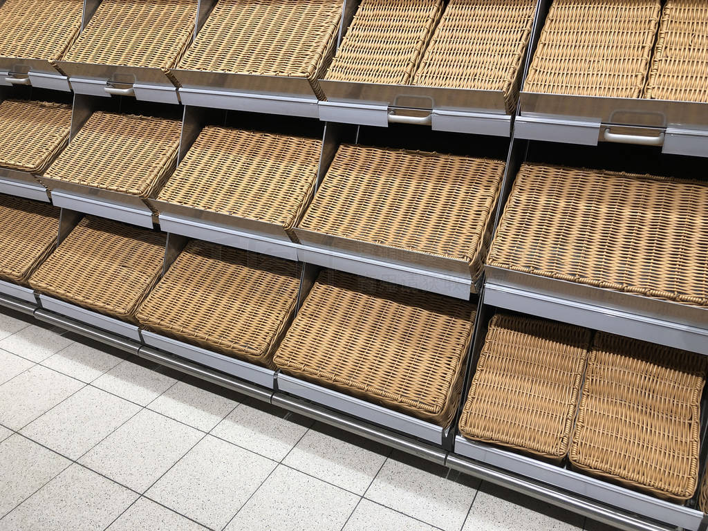 Empty shelves for goods in supermarket. Retail store equipment