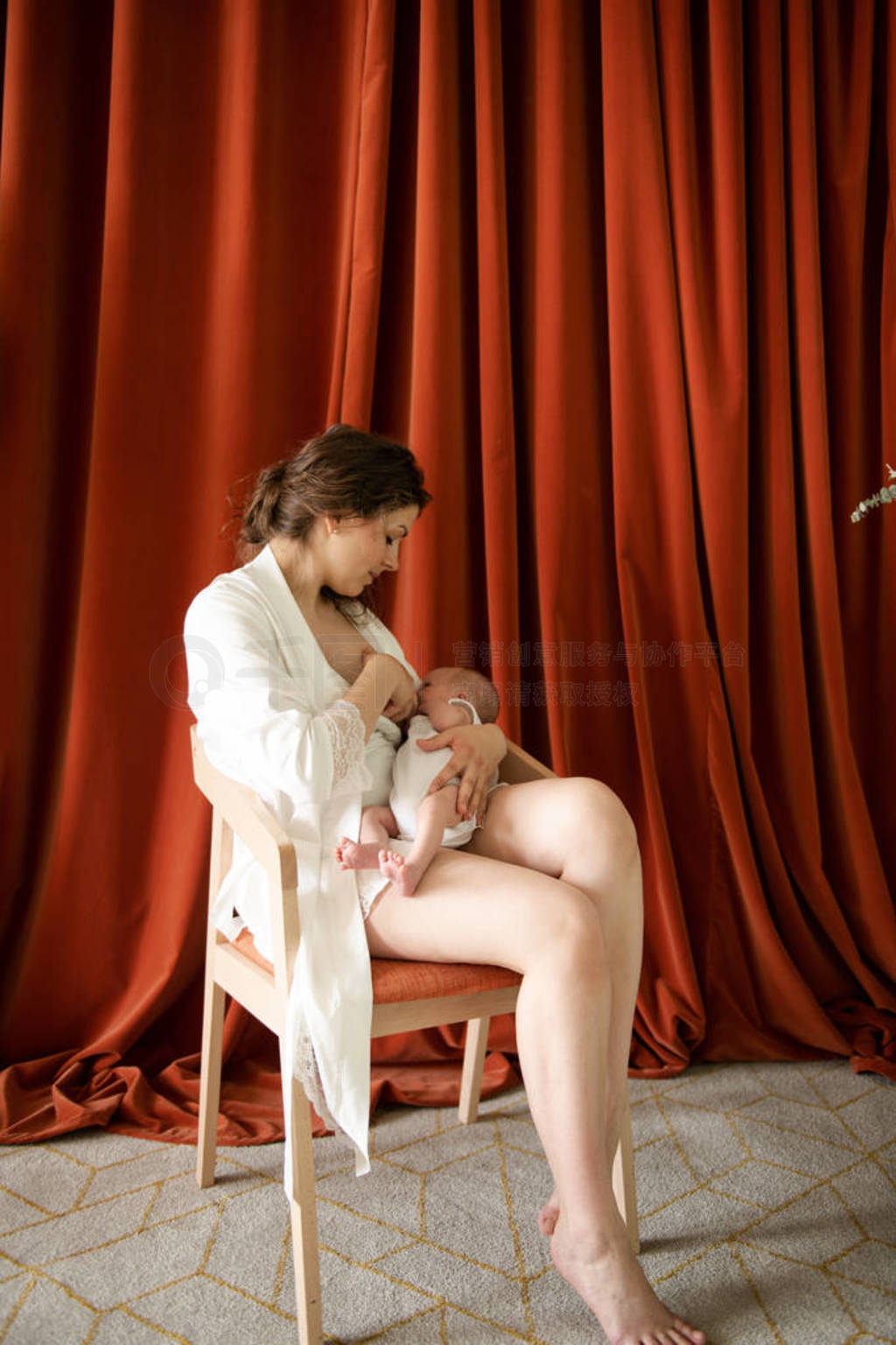 young woman breastfeeding her infant child with grain effect