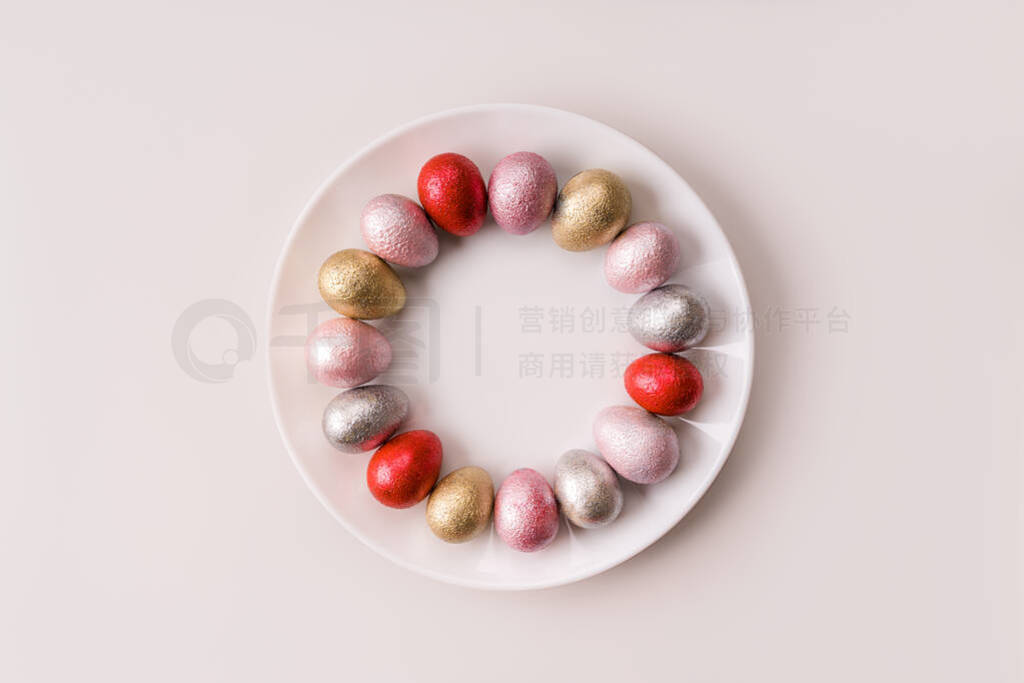 Colored chicken and quail eggs of pink, silver, golden and blue