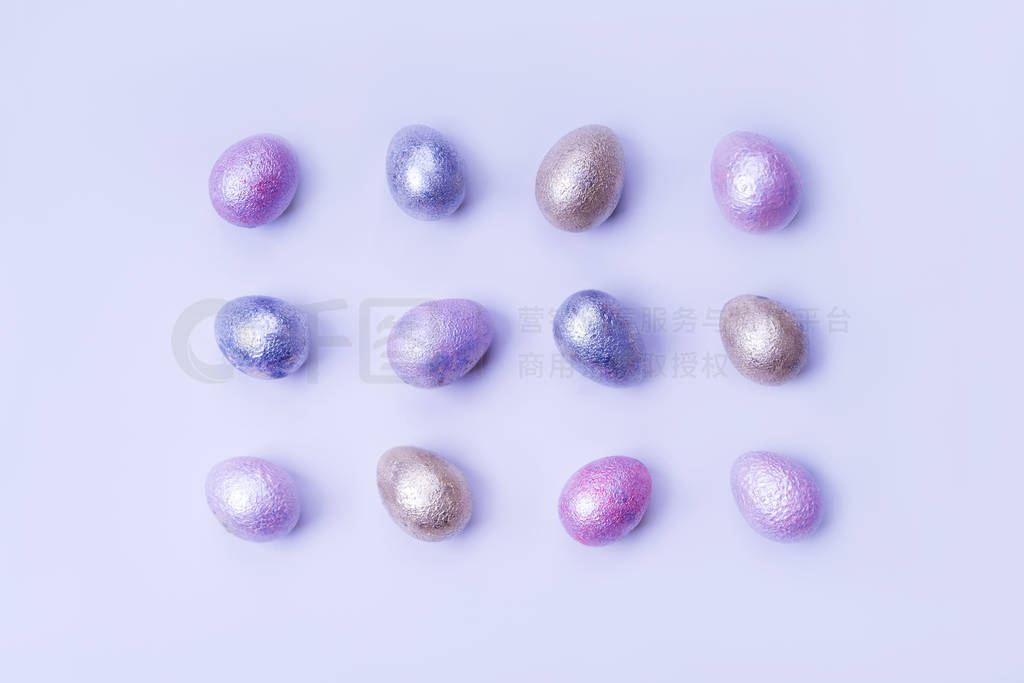 Colored chicken and quail eggs of pink, silver, golden and blue