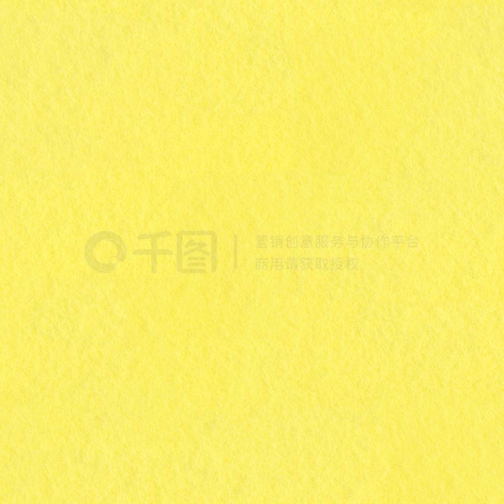 Background of soft yellow felt. Seamless square texture, tile re