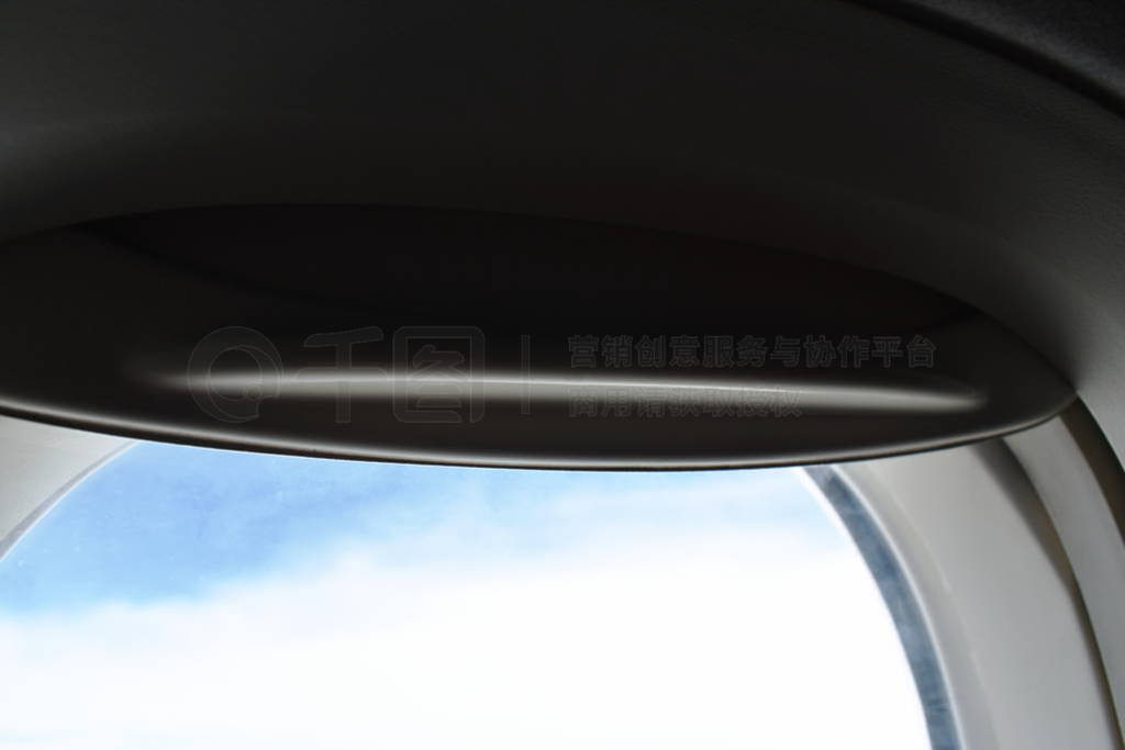 close up of plane window frame height in sky