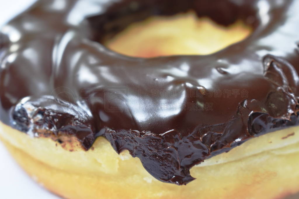 chocolate cream donuts on white background