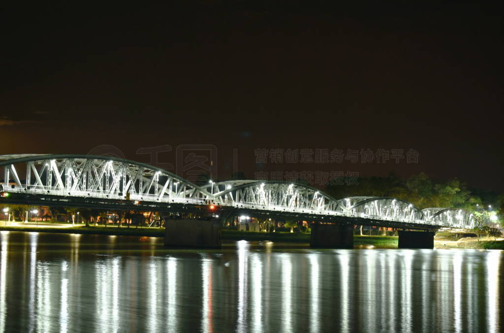 bridge cross river and reflection light bulb on night in Vietna