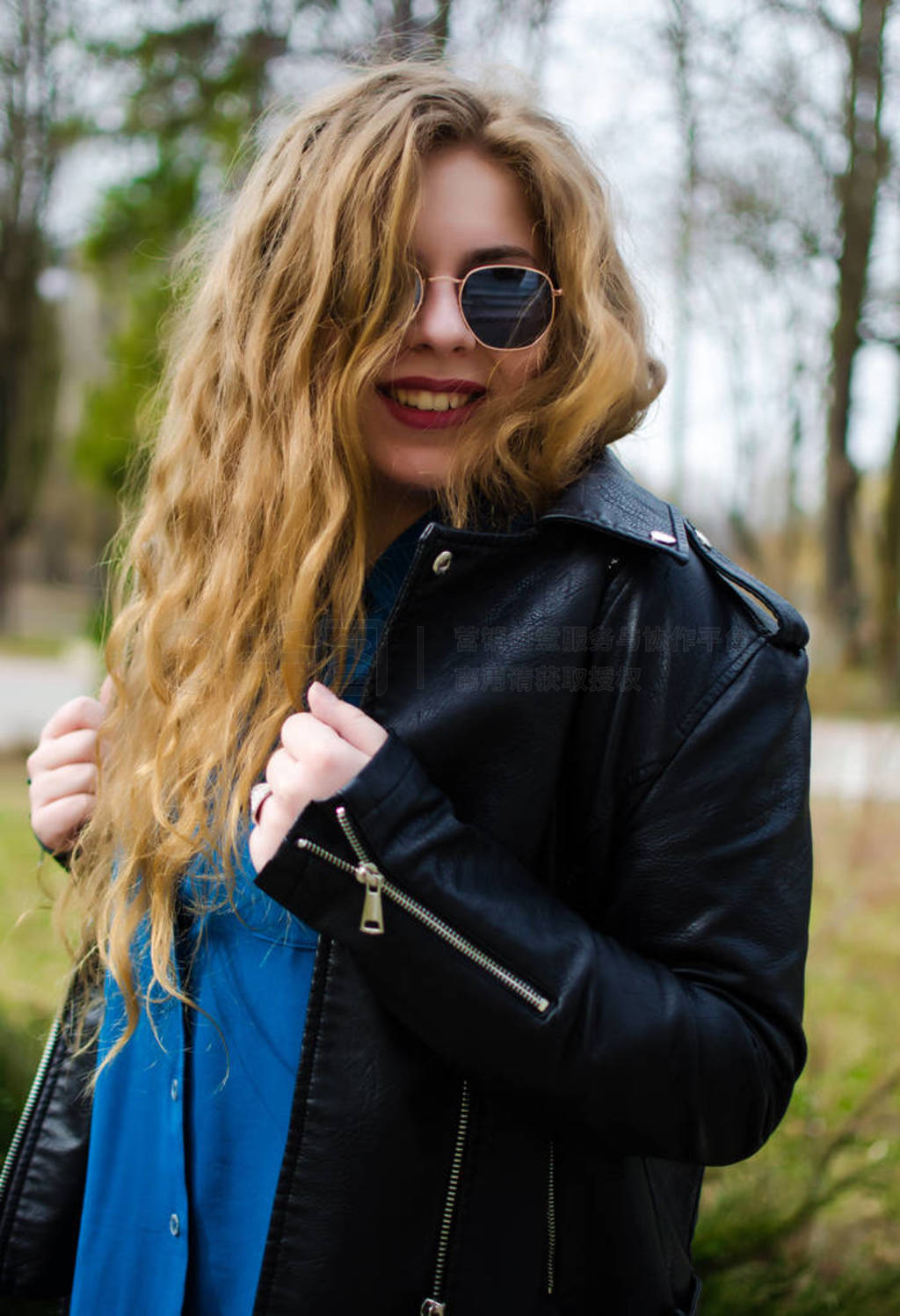 Young smiling girl with curly hair