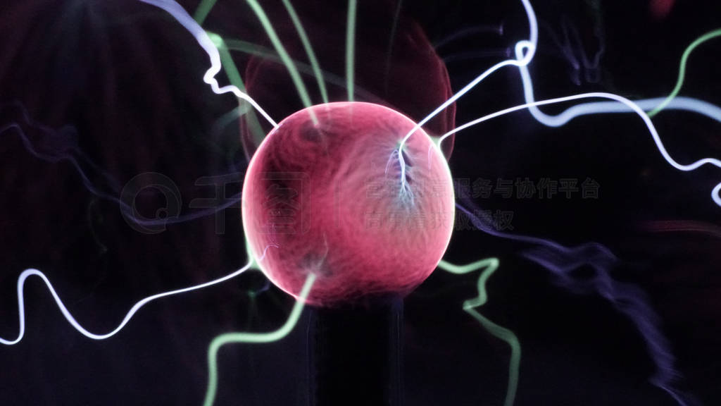 View of plasma ball with moving energy rays inside on black back