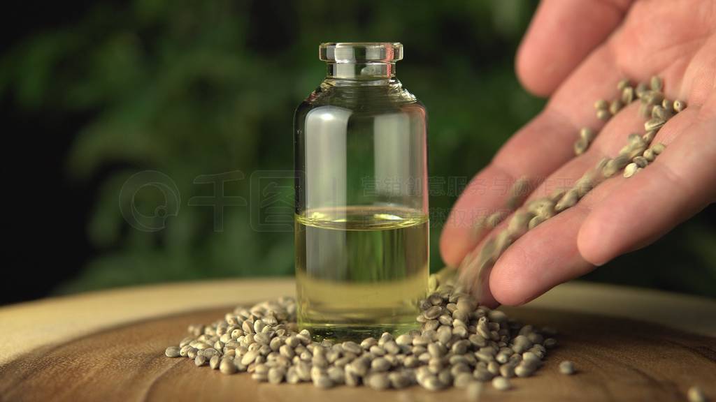 Cannabis cbd oil bottles jars, hemp pills and capsules on table