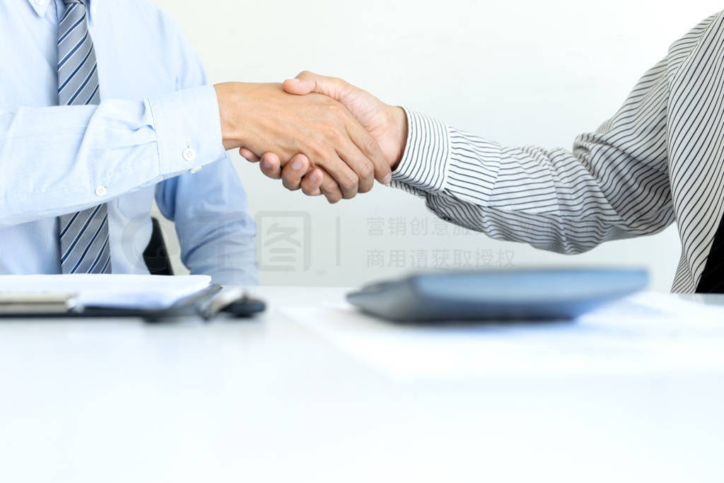 handshake of Real estate agent and customers in meeting
