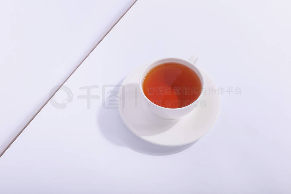 Ceramic cup with tea, on a white background. The harsh shade of