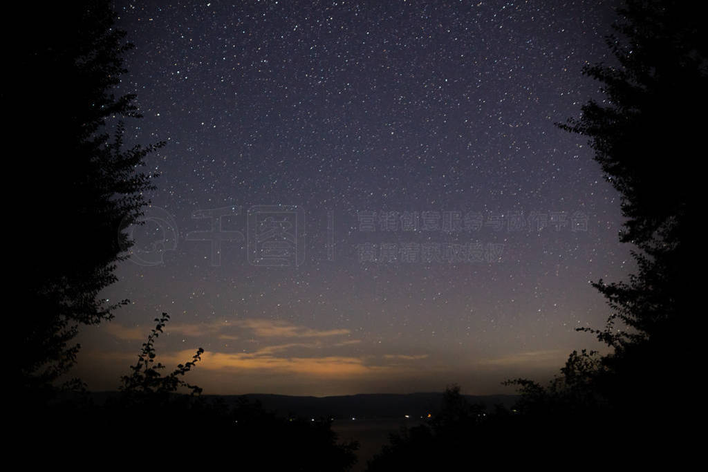 Amazing starry night sky with Milky way and falling stars above