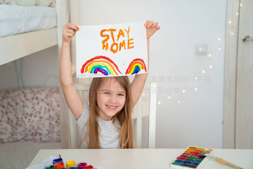 small girl drew rainbow and poster stay home.