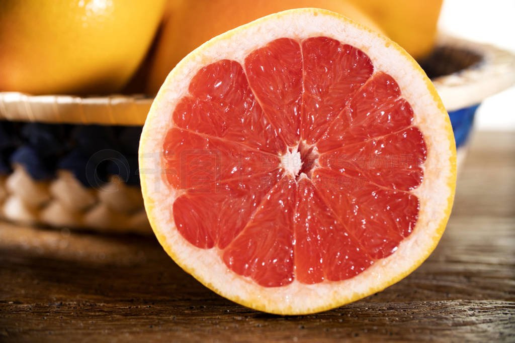Freshly red grapefruit on wooden background