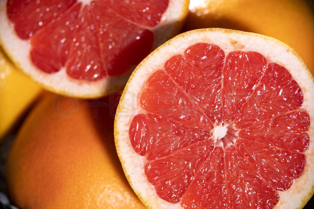 Freshly red grapefruit on wooden background