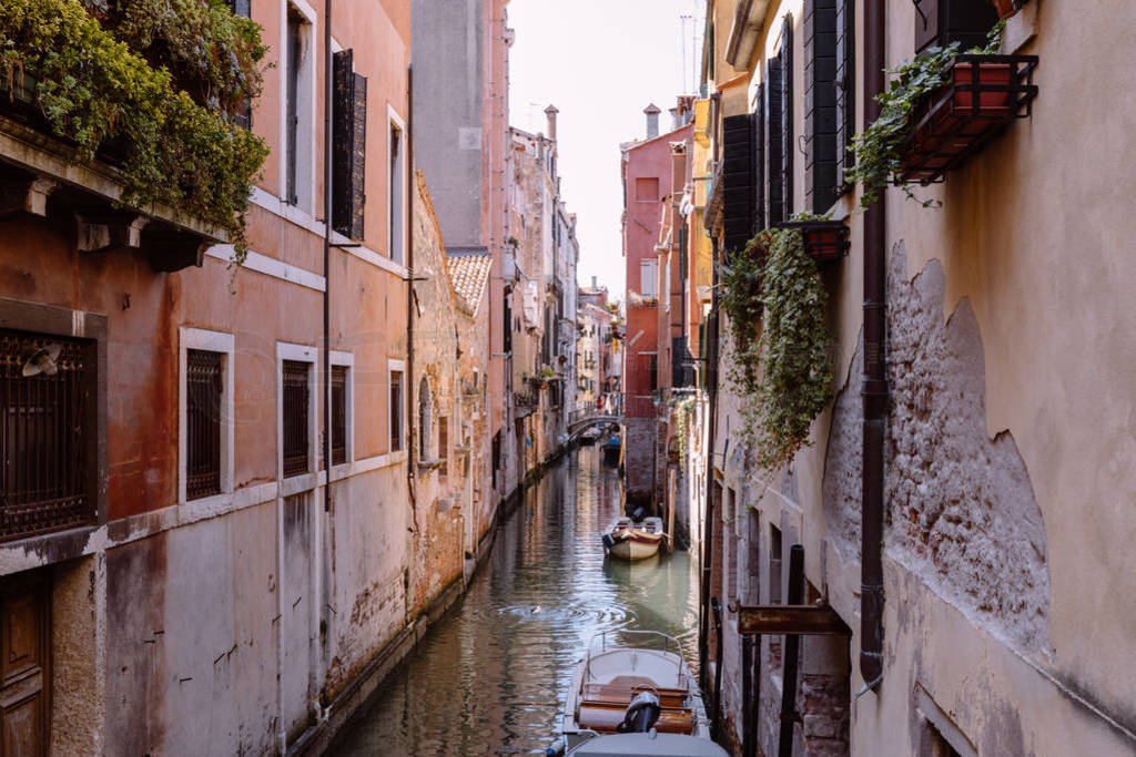 Panoramic view of Venice narrow canal with historical buildings