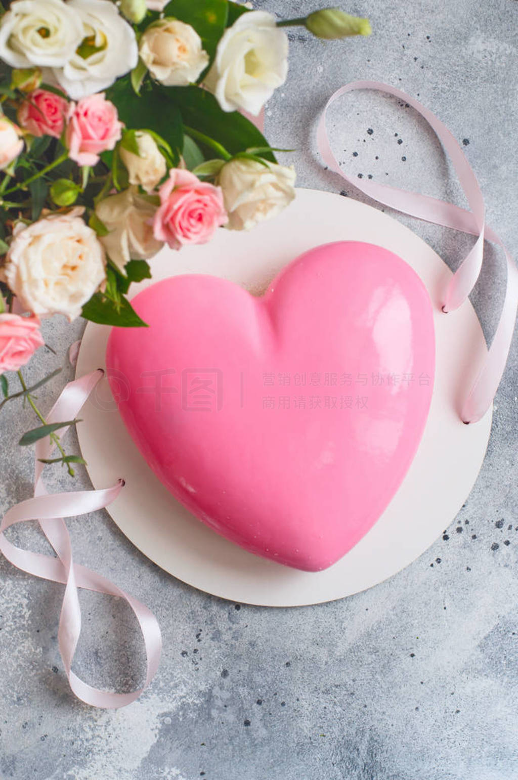 Gift set - pink heart-shaped mousse cake and a large bouquet of