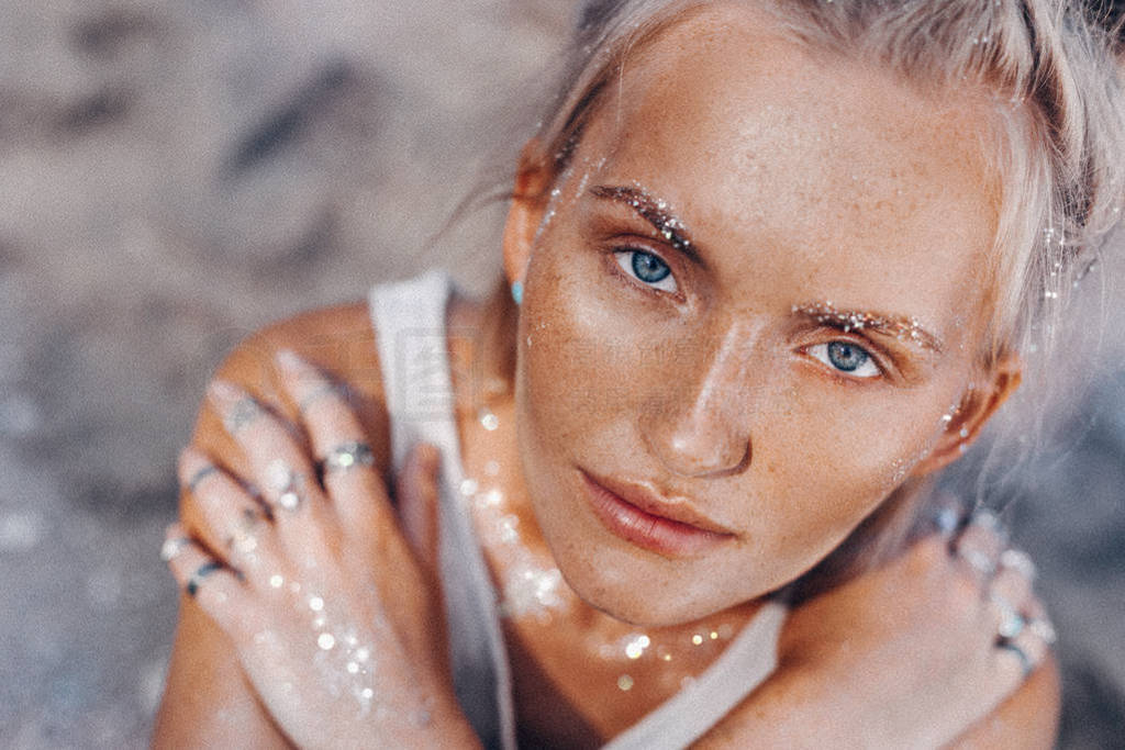 beautiful young fashion model on the beach. Close up portrait