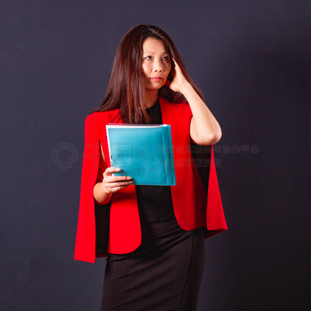 Presentable asian business woman in an elegant red jacket with