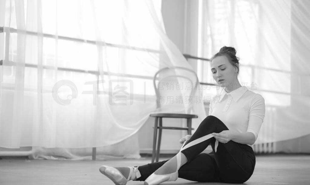 Young ballet dancer on a warm-up. The ballerina is preparing to