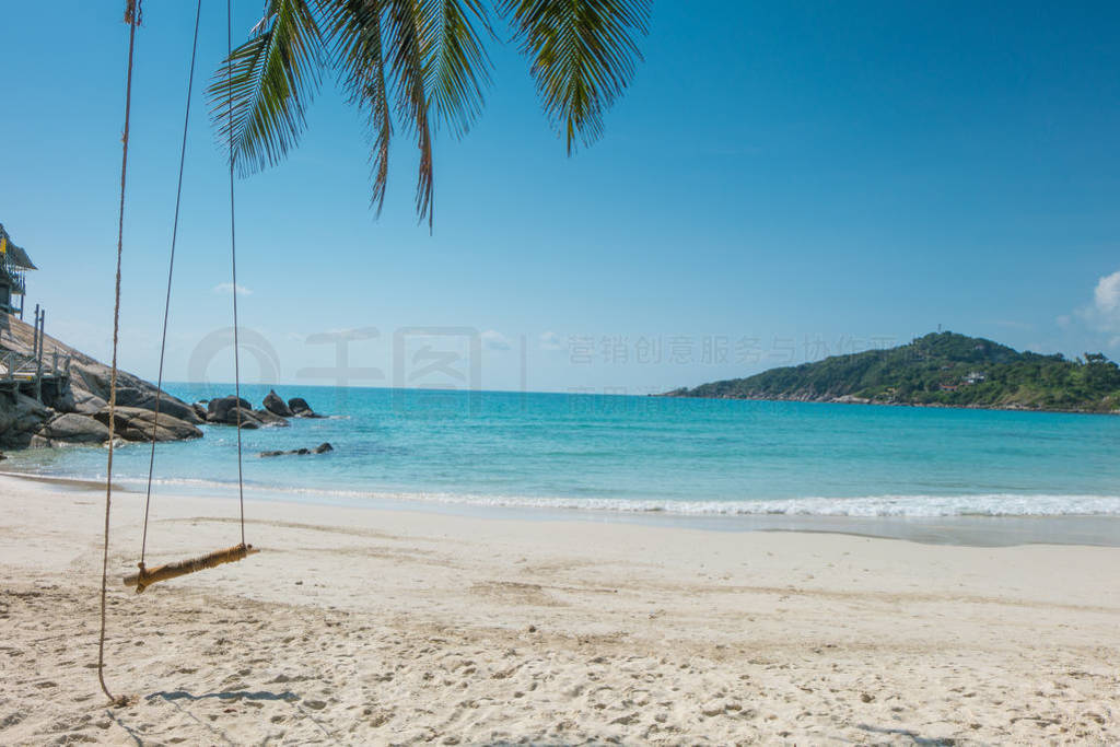 Empty wooden swing on an exotic beach - Phangan island, Thailand