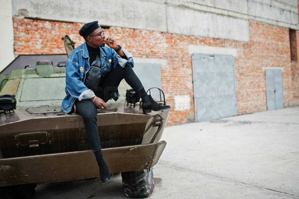 m your captain. African american man in jeans jacket, beret and