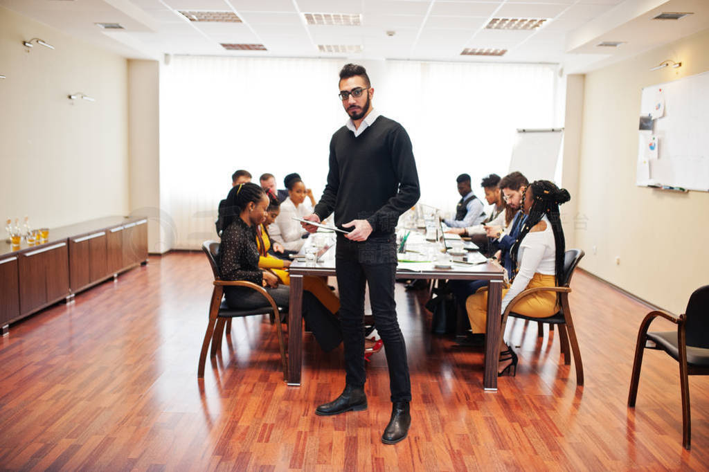 Face of handsome arabian business man, holding clipboard on the