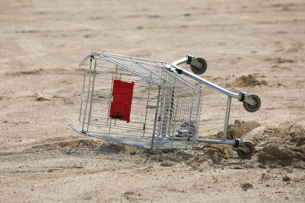 Overturned Empty Supermarket Shopping Cart