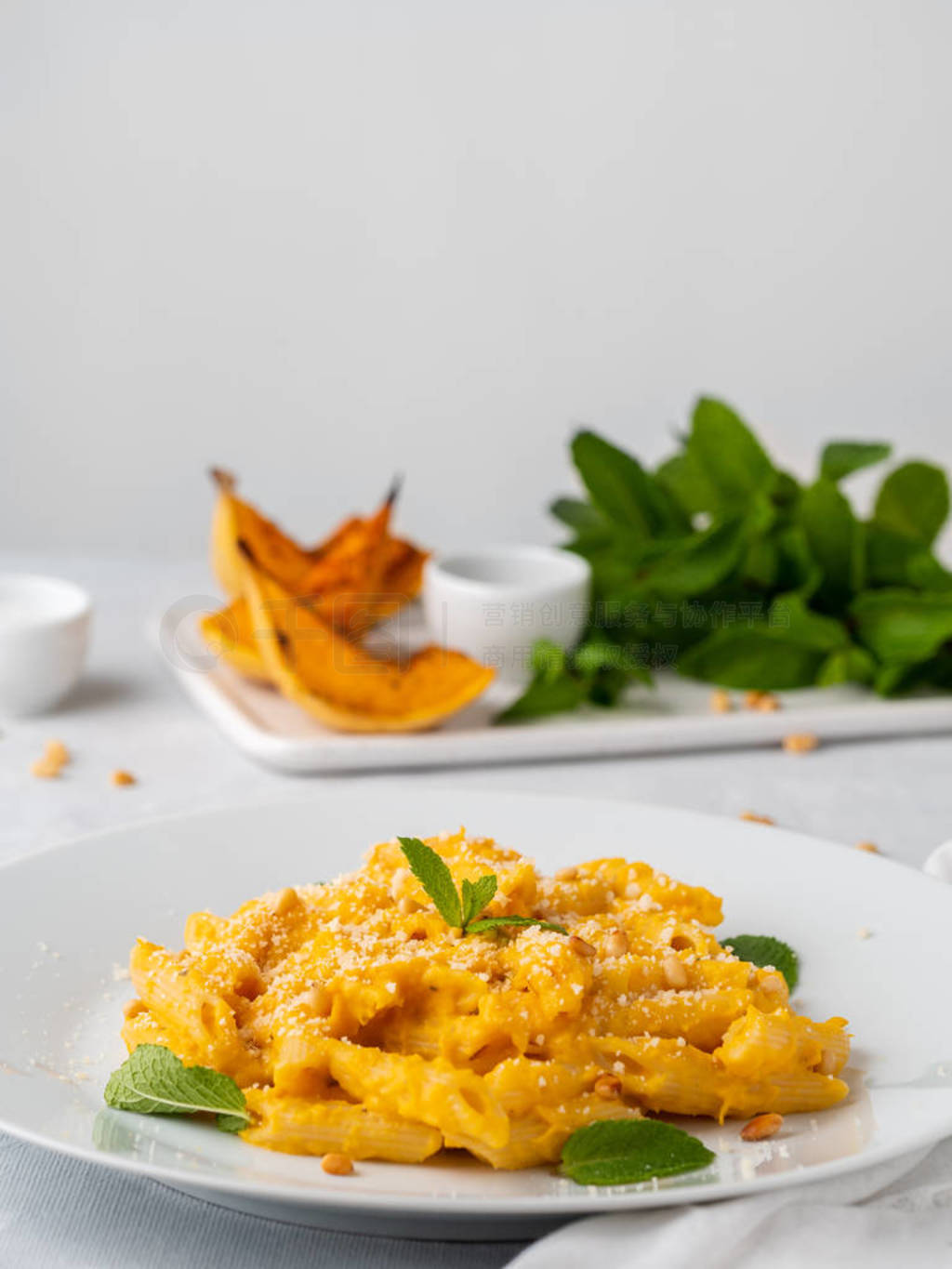 Pumpkin pasta penne with thick creamy sauce of baked squash and