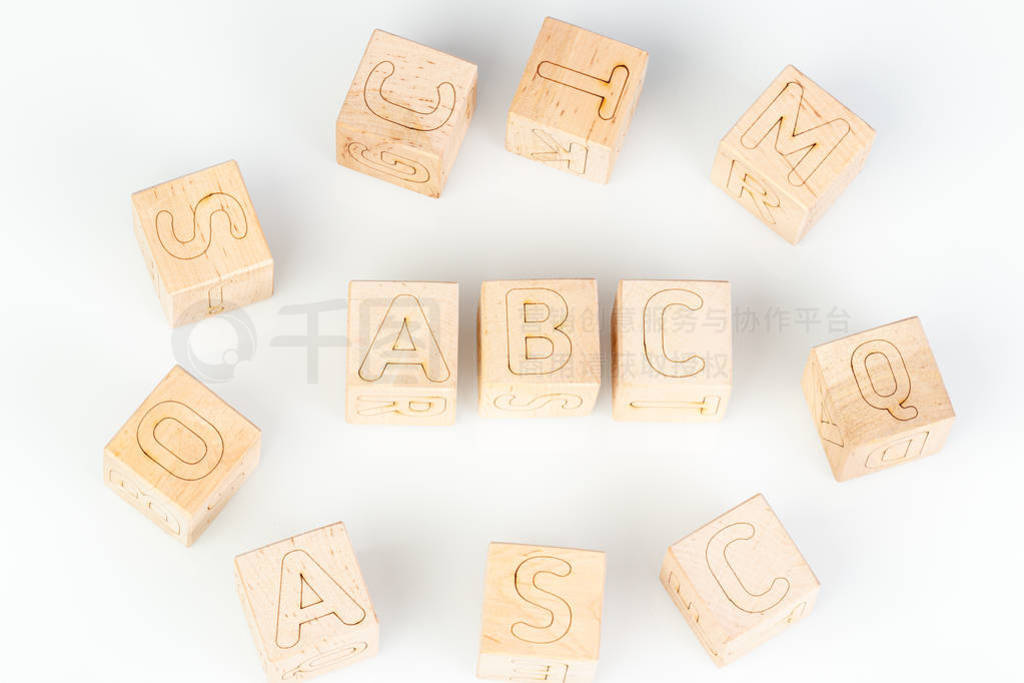 Wooden cubes with letters ABC on a white background