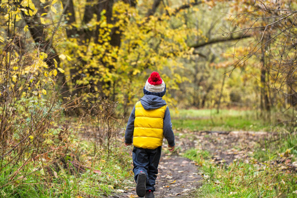 A little boy walks away