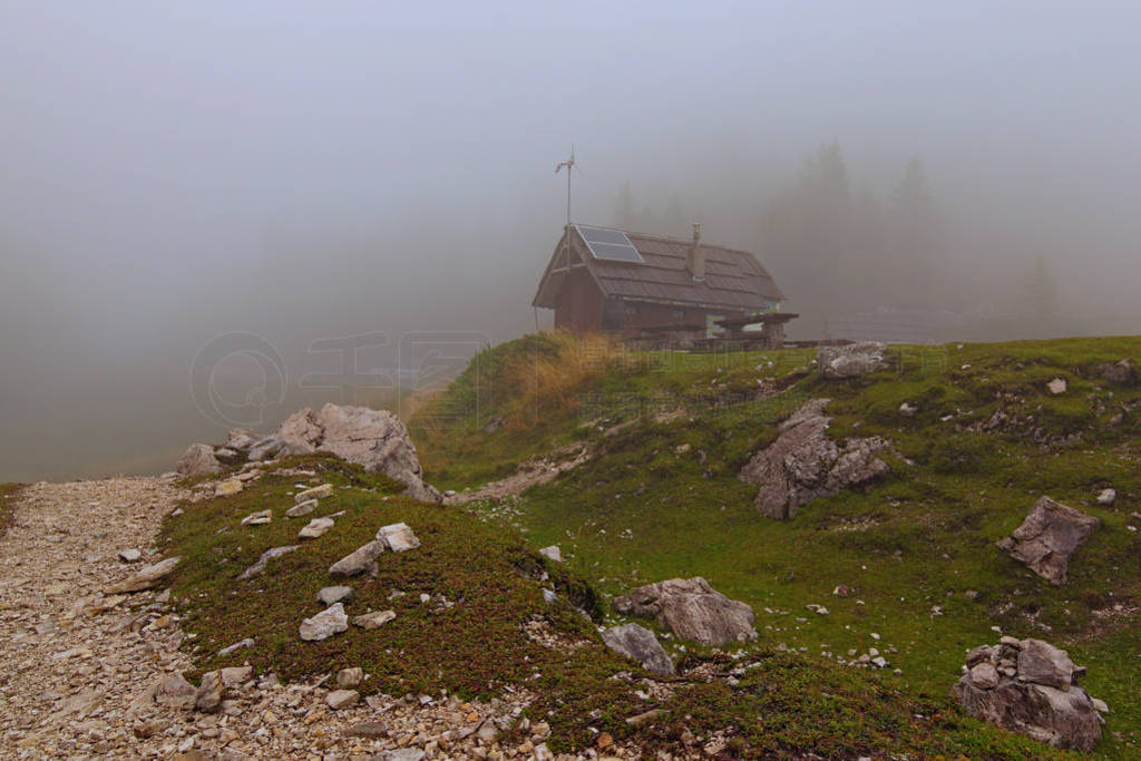 Mysterious landscape photo of Vrsic Pass. Closed open-air cafe w