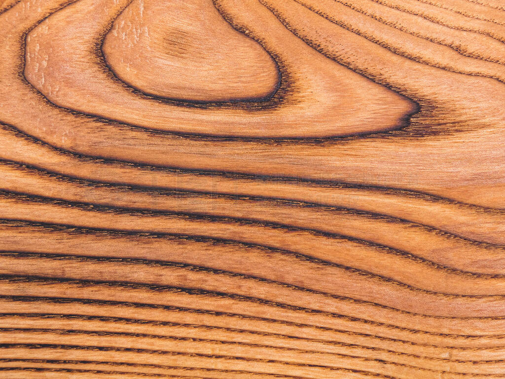 Brown texture surface of wooden board with annual rings. Natural