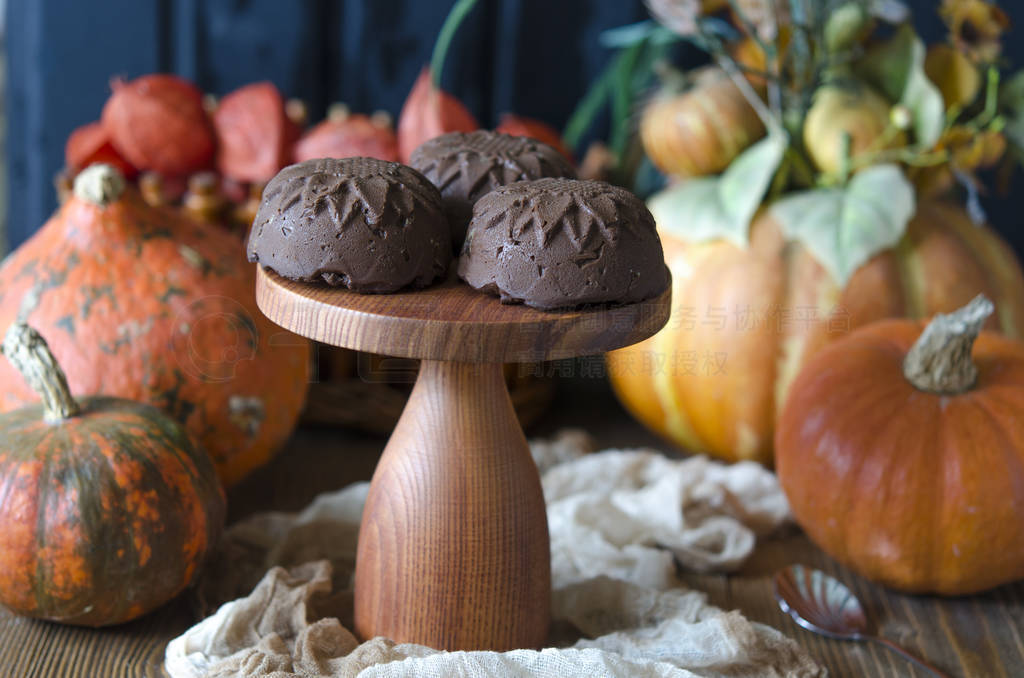Chocolate dessert with pumpkin on agar on a stand