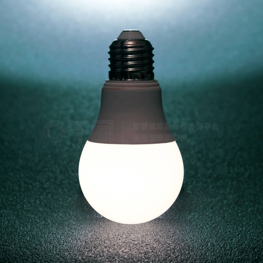 led bulb included on a dark background. everyday household item