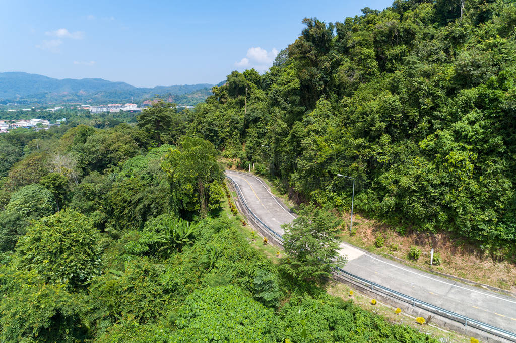 Aerial view drone shot of Asphalt road curve on mountain