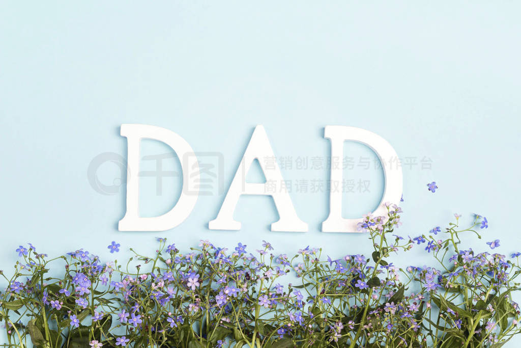 Fathers day concept with forget-me-not flowers border and word